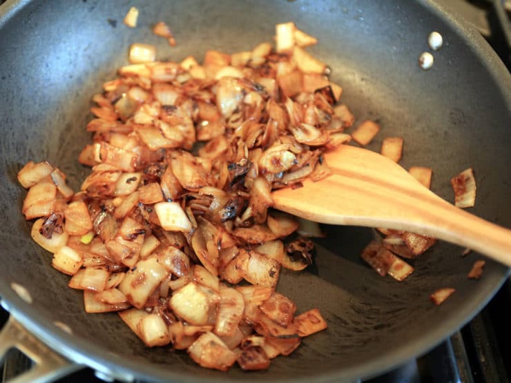 Browning mushrooms in a skillet.