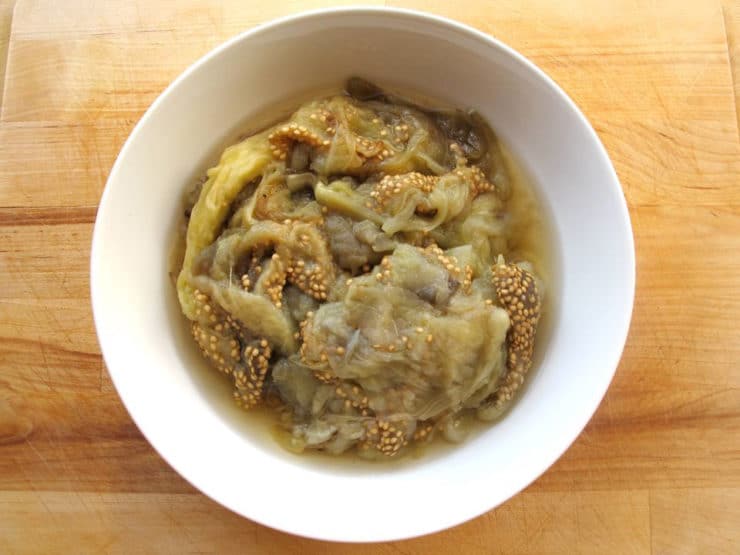 Classic Baba Ghanoush - Recipe for smoky Middle Eastern roasted eggplant dip with tahini, garlic, lemon, olive oil and spices.