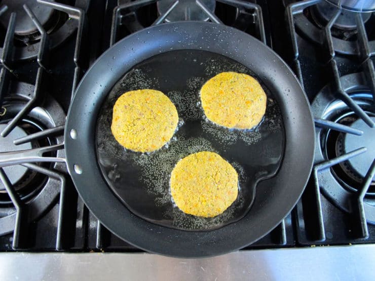 Black eyed pea patties in a skillet.