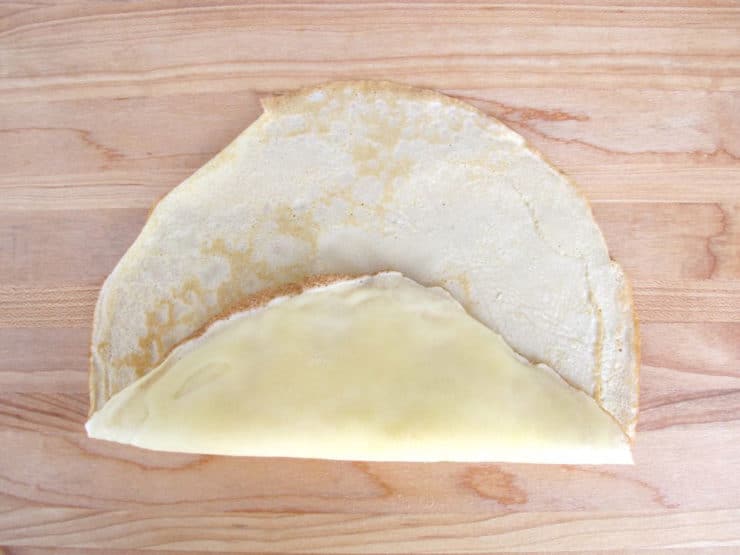 One edge of blintz folded up over filling.