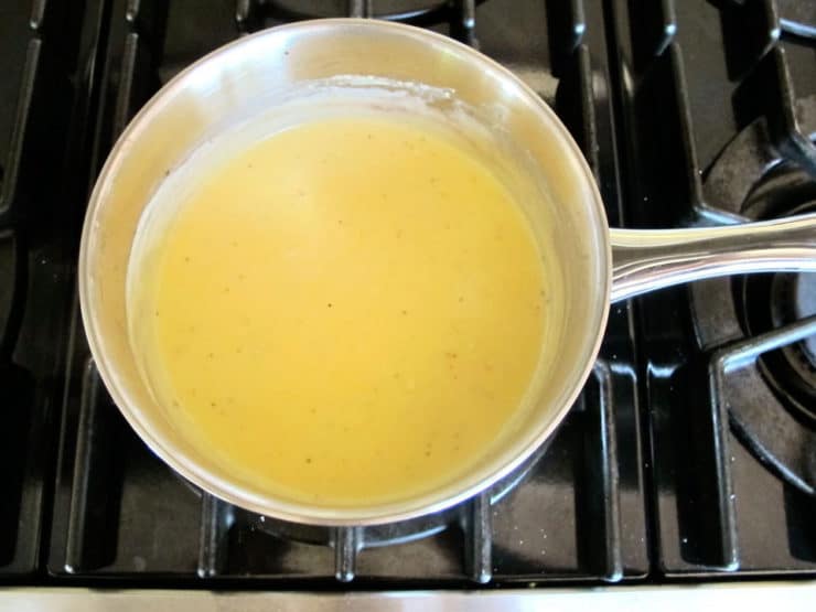 Cheese sauce in a saucepan.