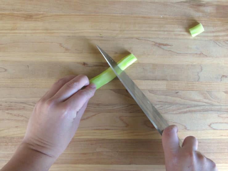 Chopping broccoli stems.