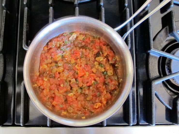 Tomato onion reduction in skillet.