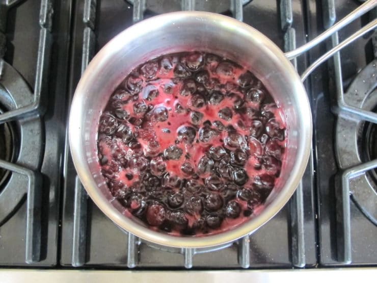 Adding cornstarch to hot cherries.