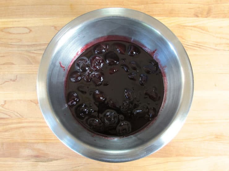 Chilling cherries to thicken.