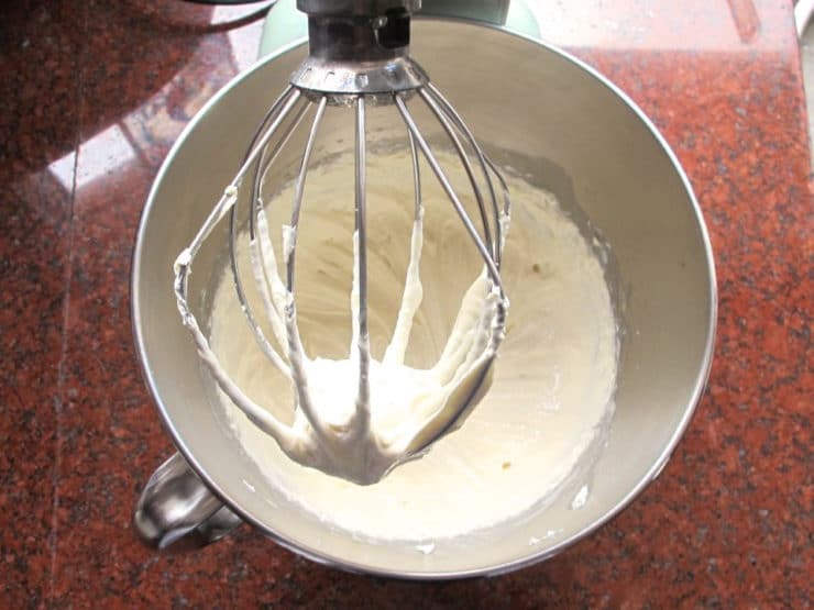Whipping cream cheese and milk in a stand mixer.