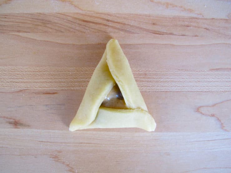 Bottom edge of dough circle folded over filling.