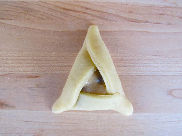 Pinch triangle points together.