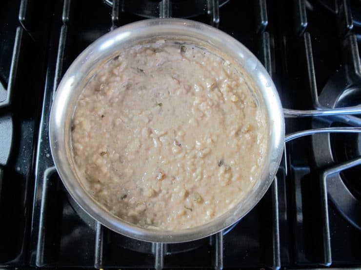 Raisins stirred into rice pudding.