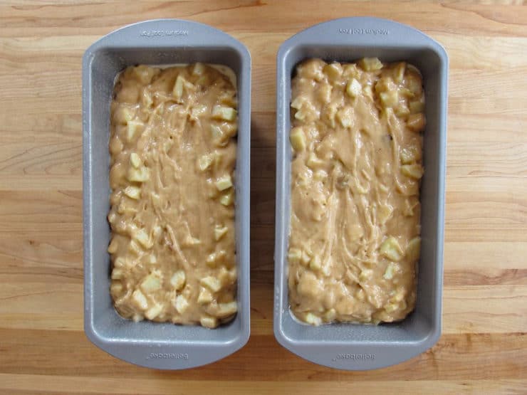 Apple cake batter in two loaf pans.