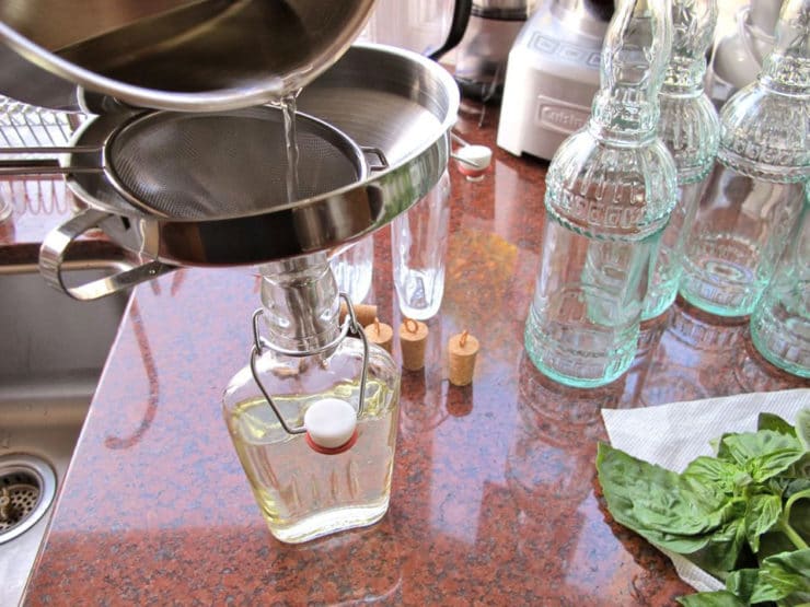 Straining simple syrup.