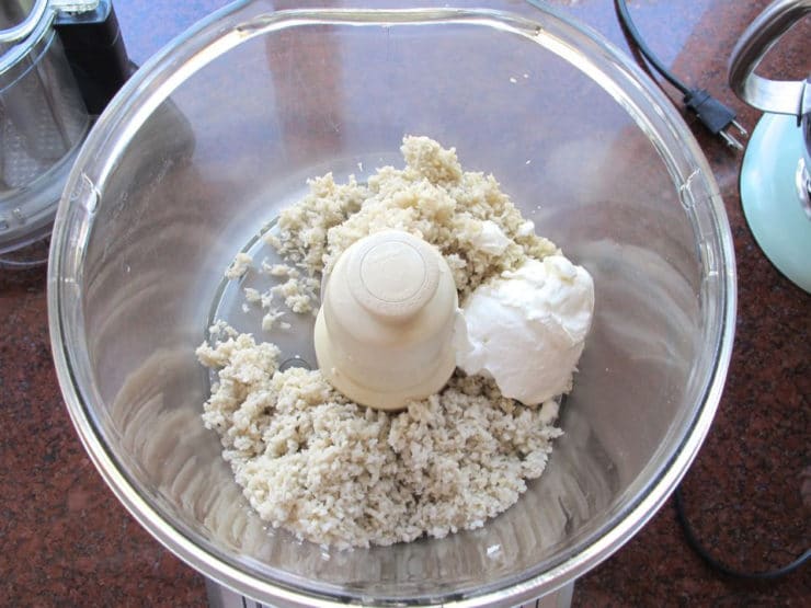 Sour cream and horseradish in a food processor.