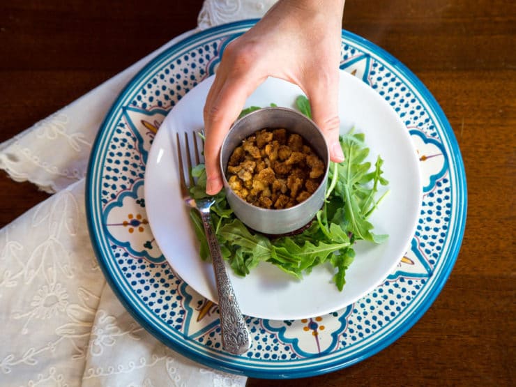 Removing ring mold from salad.