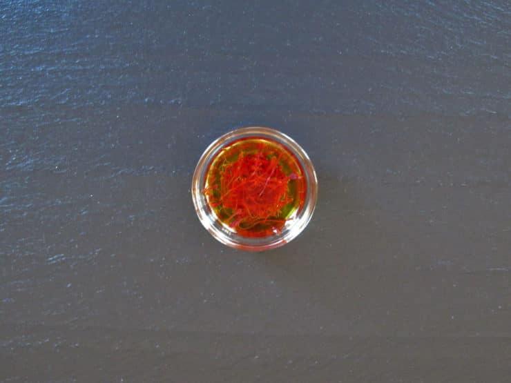 Saffron threads in water.
