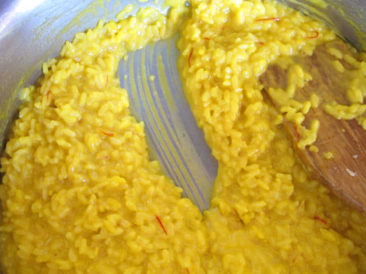 Thickened risotto in a saucepan.
