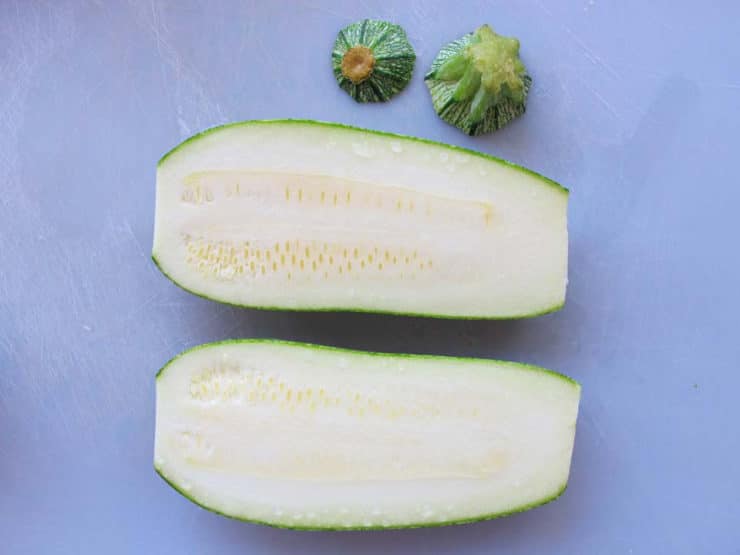 Zucchini sliced in half lengthwise.