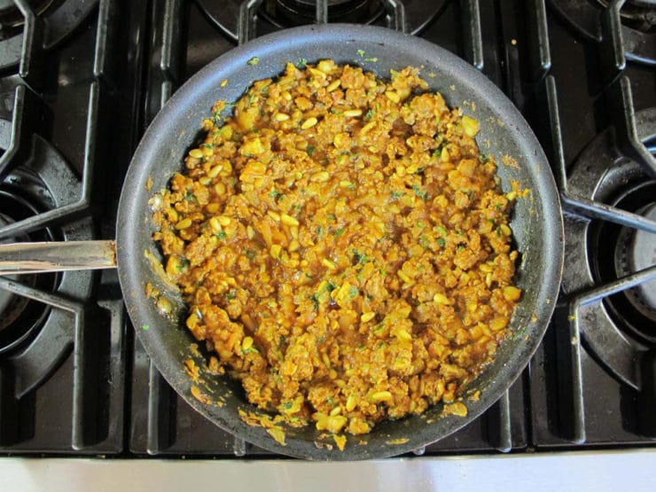 Stuffed zucchini filling in a skillet.