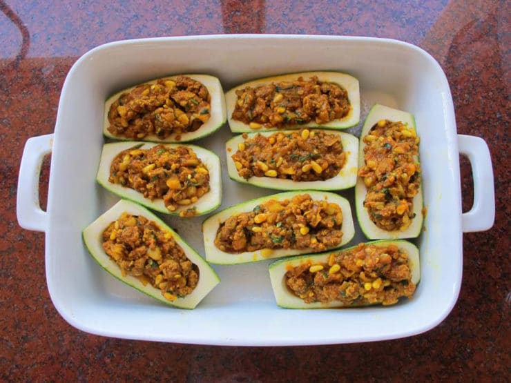 Stuffed zucchini in a baking dish.
