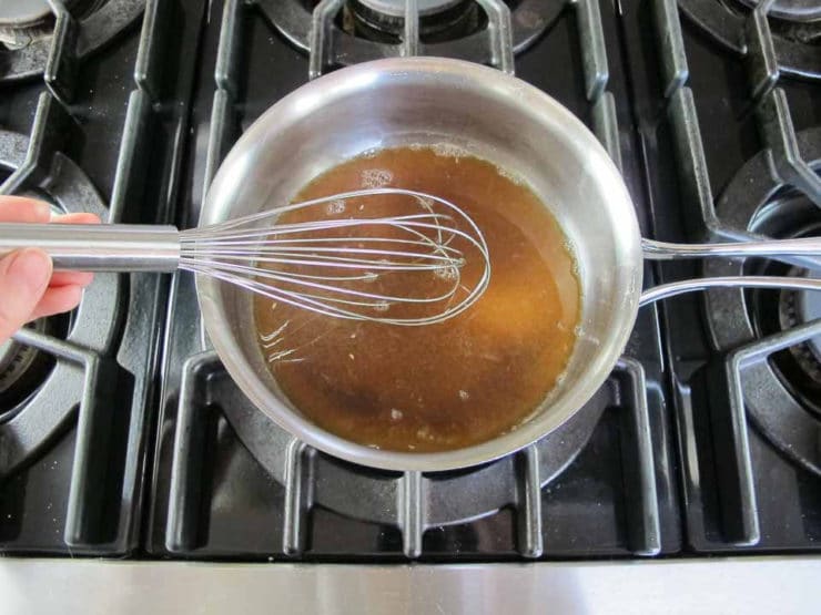 Orange juice and sugar on the stove.