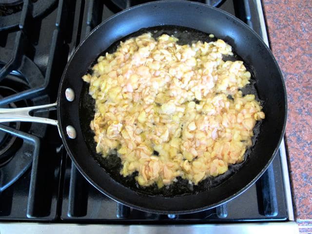 Chicken skin in a skillet.