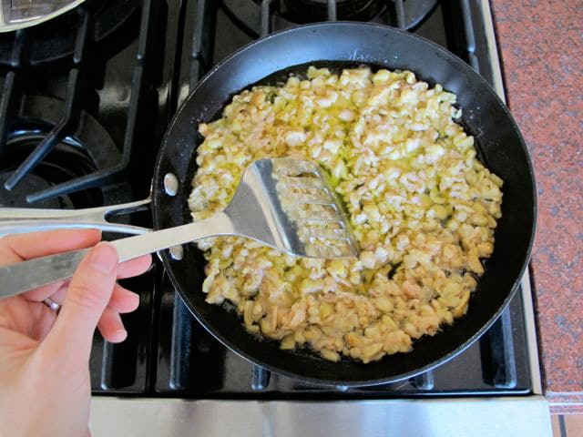 Chicken skin in a skillet.