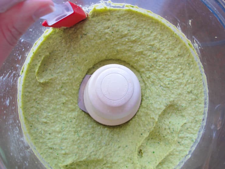 Pureed hummus in food processor.