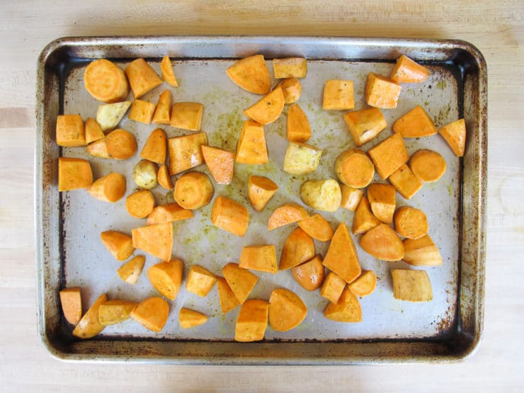 Diced potatoes on a baking sheet.