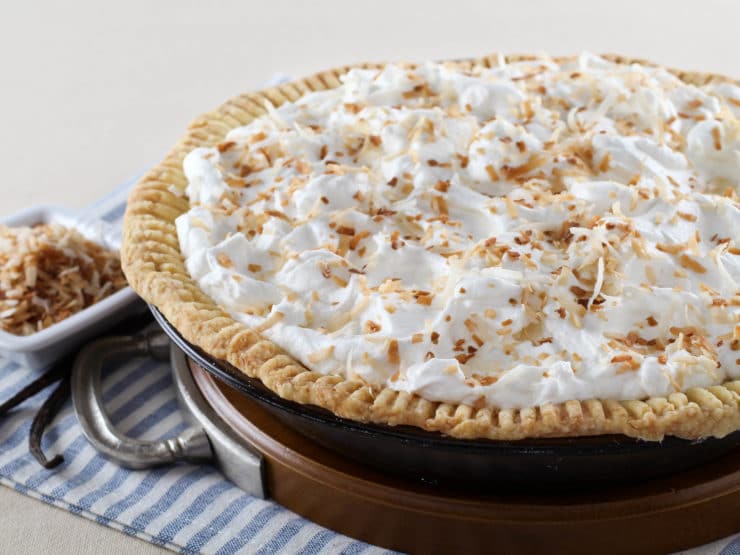 Coconut Cream Pie – Flaky All-Butter Crust Filled with Coconut Cream and Topped with Lightly Sweetened Whipped Cream and Toasted Coconut. Nostalgic, Family-Inspired Recipe from Kelly Jaggers.