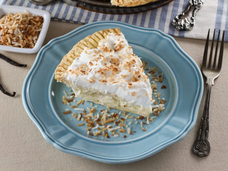 Coconut Cream Pie – Flaky All-Butter Crust Filled with Coconut Cream and Topped with Lightly Sweetened Whipped Cream and Toasted Coconut. Nostalgic, Family-Inspired Recipe from Kelly Jaggers.