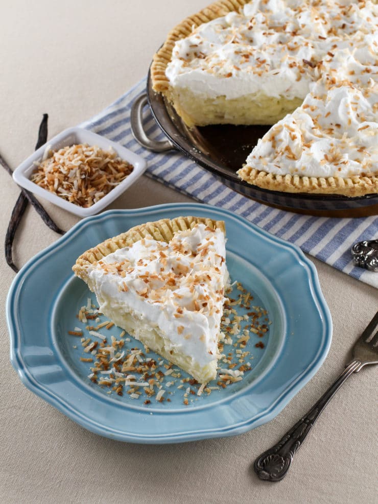 Coconut Cream Pie – Flaky All-Butter Crust Filled with Coconut Cream and Topped with Lightly Sweetened Whipped Cream and Toasted Coconut. Nostalgic, Family-Inspired Recipe from Kelly Jaggers