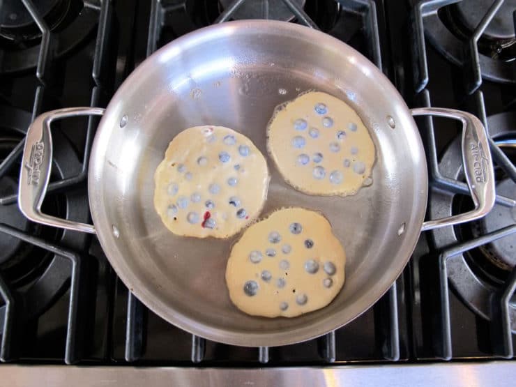 Cooking pancakes in a skillet.