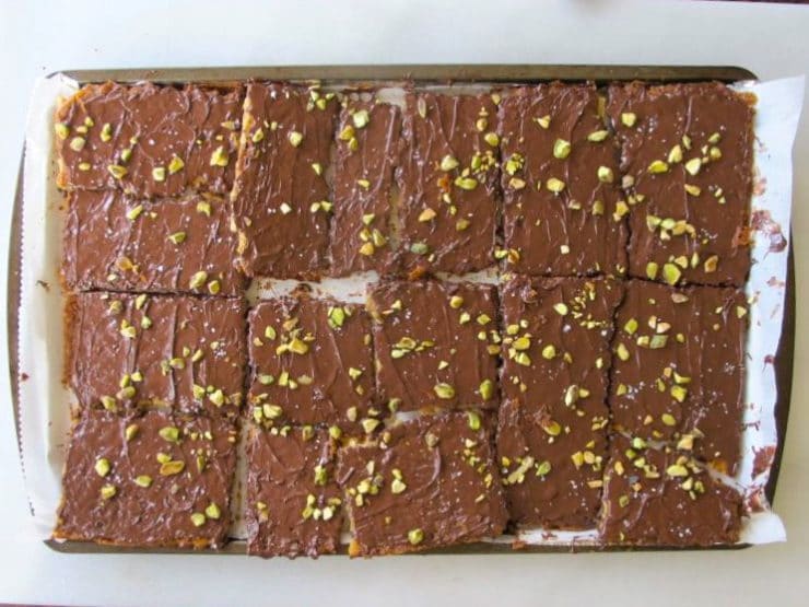 Cutting matzo toffee into squares.