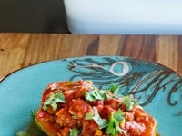 Stuffed Zucchini with ground beef or lamb, pine nuts, tomato sauce and spices. Low carb, paleo, gluten free, grain free.