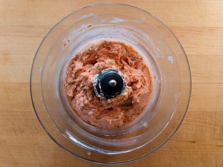 Ground lox in a food processor bowl.