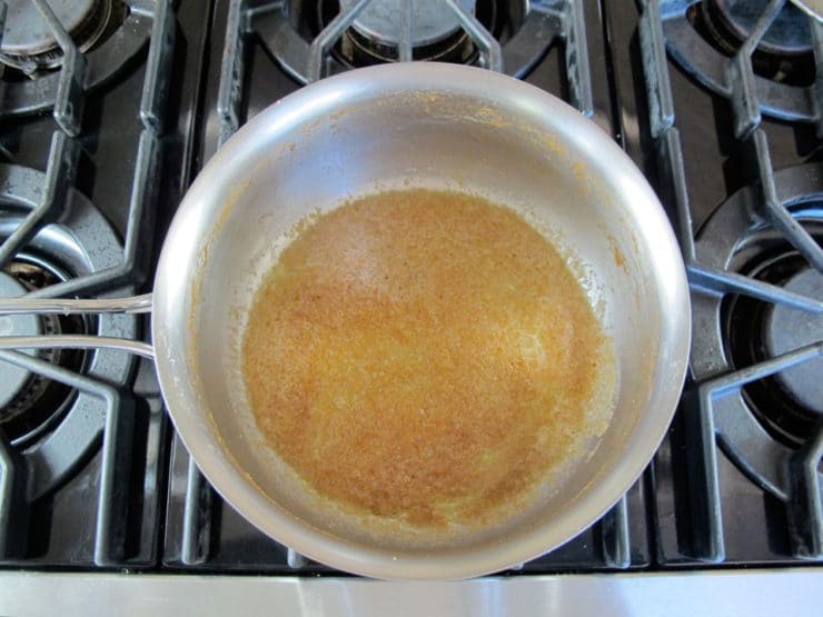 Butter and brown sugar syrup in a saucepan.