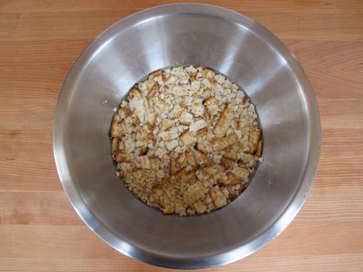 Crushed matzo in a mixing bowl.