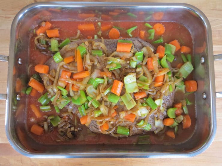 Vegetables added on top of brisket.
