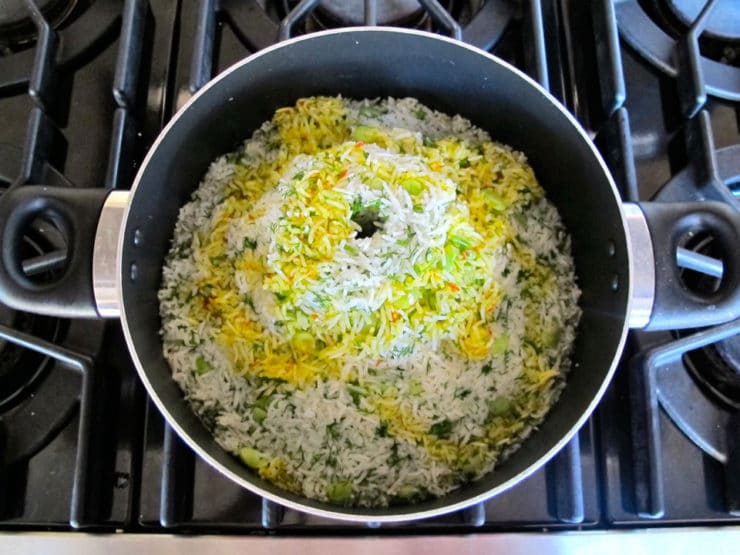 Saffron poured over volcano of rice.