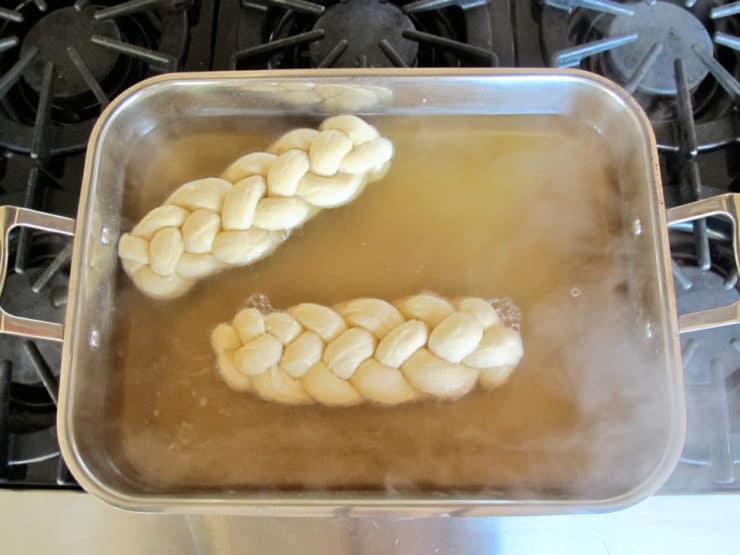 Dipped challah draining on towels.