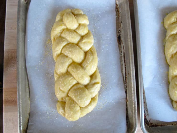 Sprinkling salt on challah loaves.