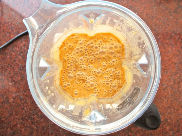 Pumpkin pie filling ingredients in a blender.