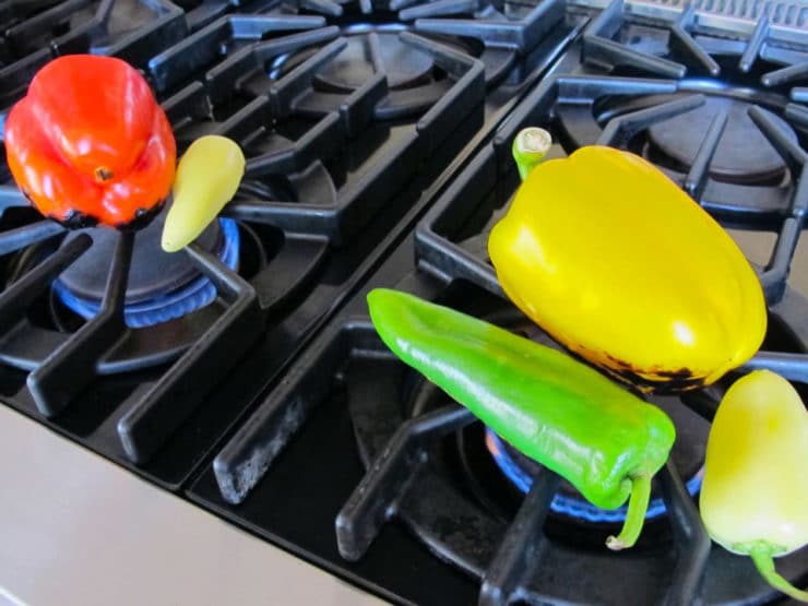 Roasting peppers over an open flame.