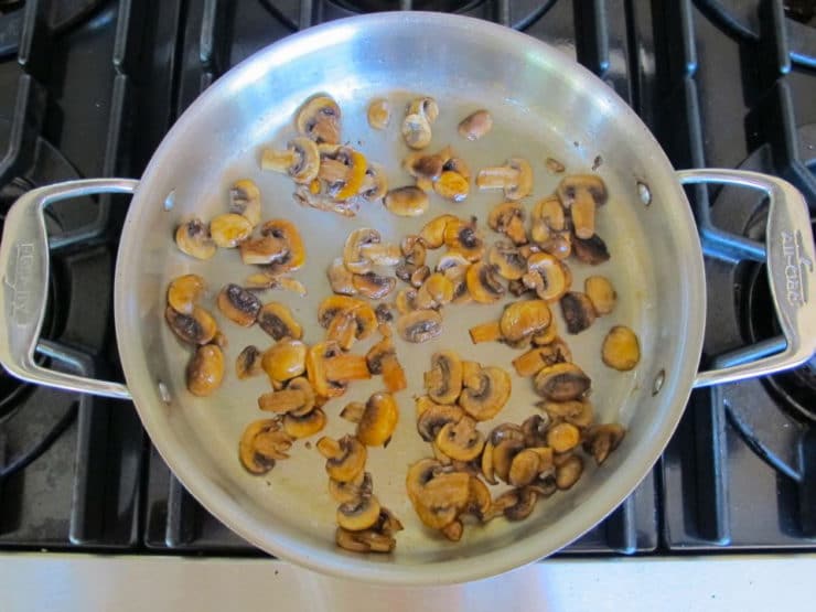 Sliced mushrooms in a saucepan.
