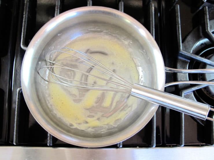 Making a roux in a saucepan.