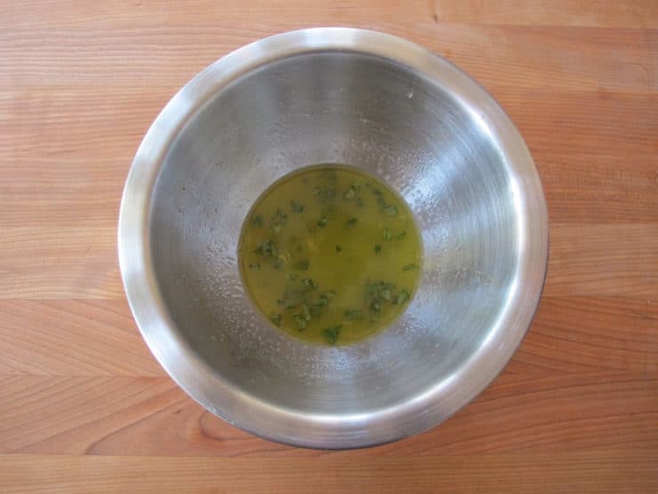 Orange juice marinade in a small bowl.