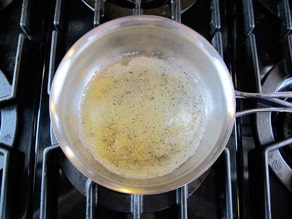 Making a roux in a saucepan.