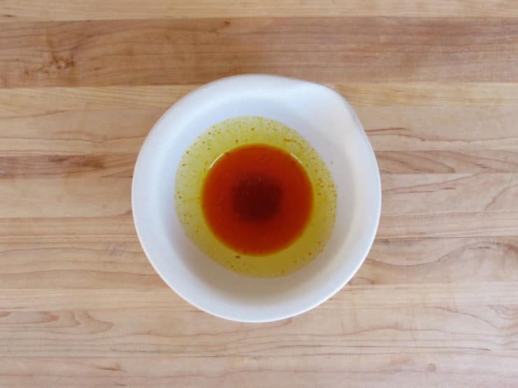 Saffron threads soaking in water.