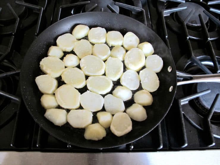 Frying potatoes in a skillet.