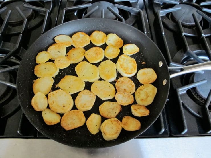 Frying potatoes in a skillet.