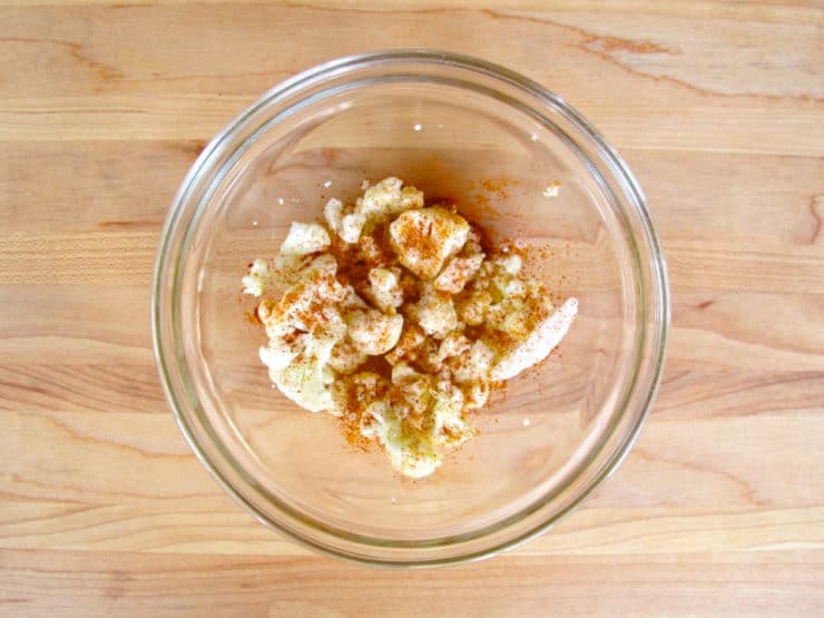 Scraps from cutting cauliflower in a bowl with oil.
